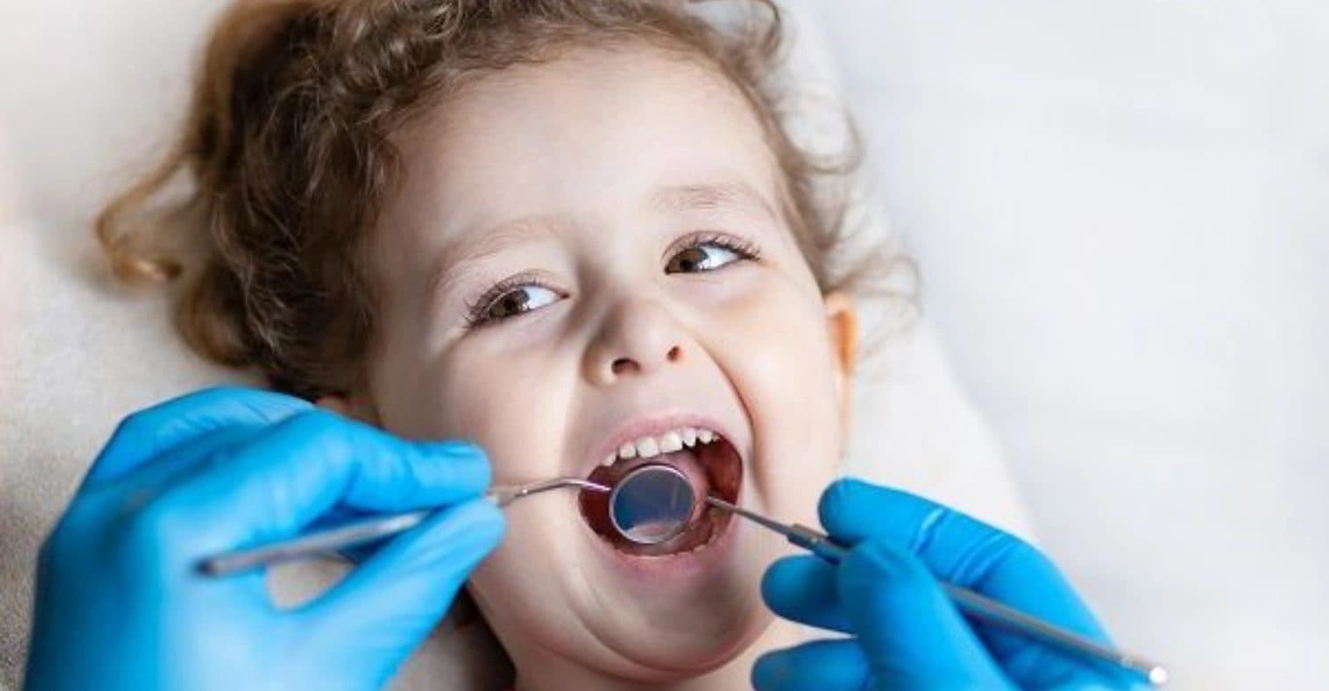 Happy child during a gentle dental check-up